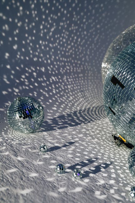Close-up of disco balls casting intricate reflections, perfect for party themes.